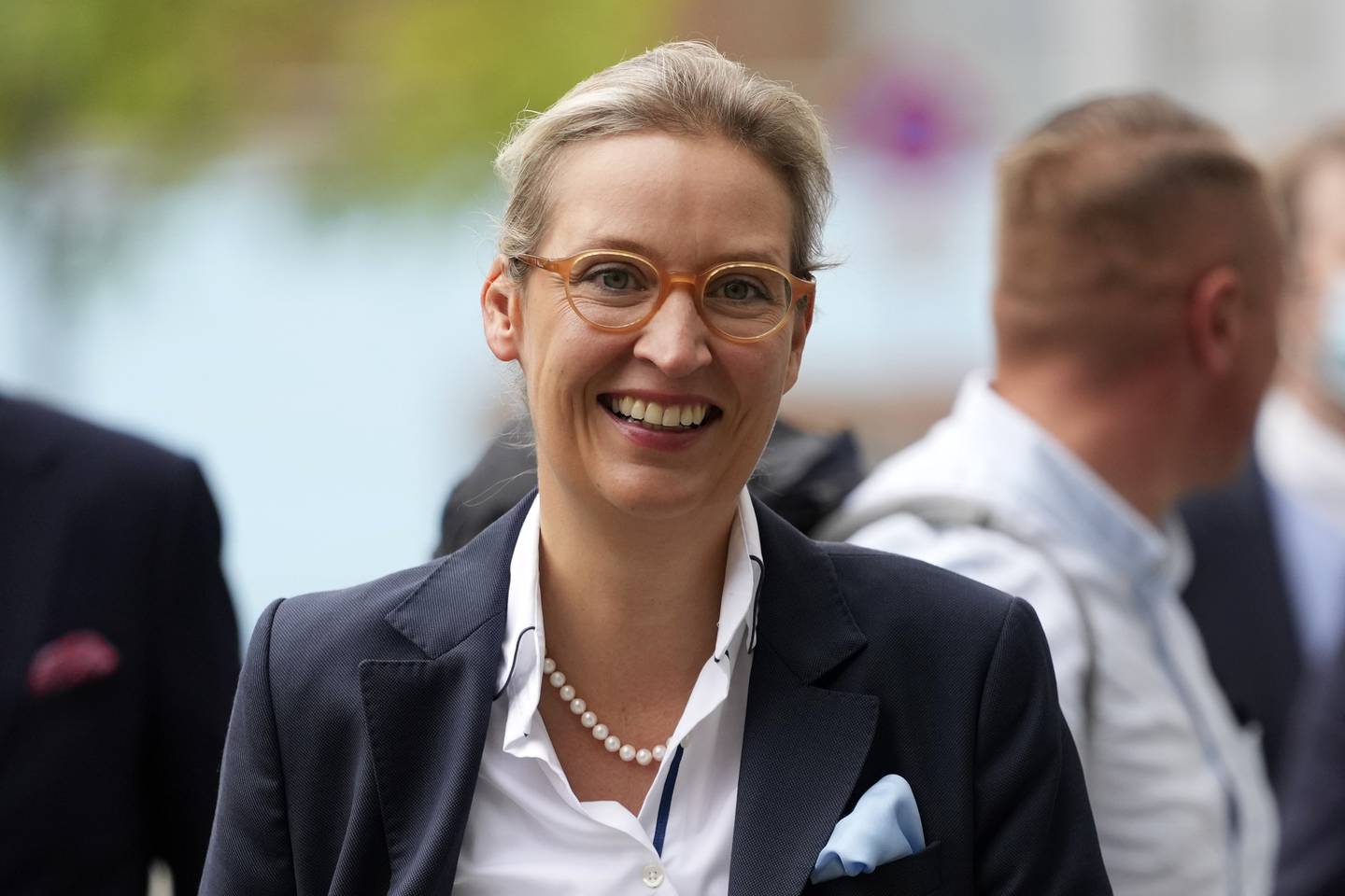 Parliamentary group co-leader and top candidate of Germany's Alternative for Germany (AfD) party Alice Weidel arrives for a press conference in Berlin, Germany, Monday, Sept. 27, 2021. Following Sunday's election leaders of the German parties were meeting Monday to digest a result that saw Merkel's Union bloc slump to its worst-ever result in a national election and appeared to put the keys to power in the hands of two opposition parties. Both Social Democrat Olaf Scholz and Armin Laschet, the candidate of Merkel's party, laid a claim to leading the next government. (AP Photo/Matthias Schrader)