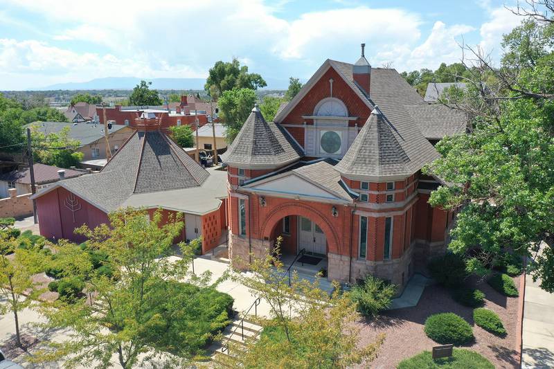 This Thursday, Aug. 22, 2019, photograph, shows an aerial view of Temple Emanuel in Pueblo, Colo. Richard Holzer was charged with a federal hate crime Monday, Nov. 4, 2019, for his part in a plot to bomb the synagogue, which is the second-oldest congregation in Colorado. (Zachary Allen/The Pueblo Chieftain via AP)