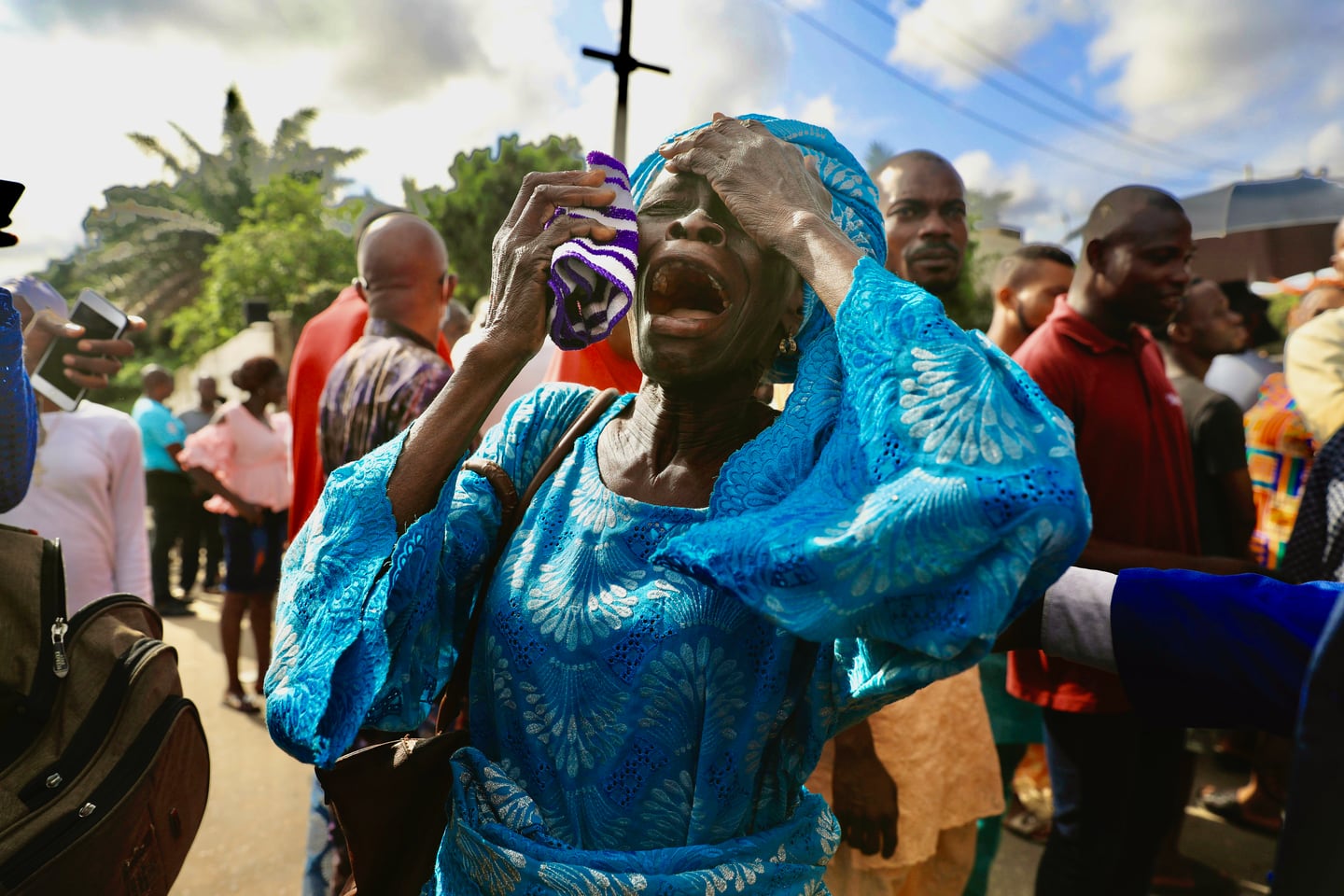 Members of Synagogue Church Of All Nations, mourn following the death of the founder T.B. Joshua, outside the church in Lagos, Nigeria Sunday, June 6, 2021. Temitope Balogun Joshua, one of Africa’s most popular televangelists who was known as T.B. Joshua, has died. He was 57. (AP Photo)