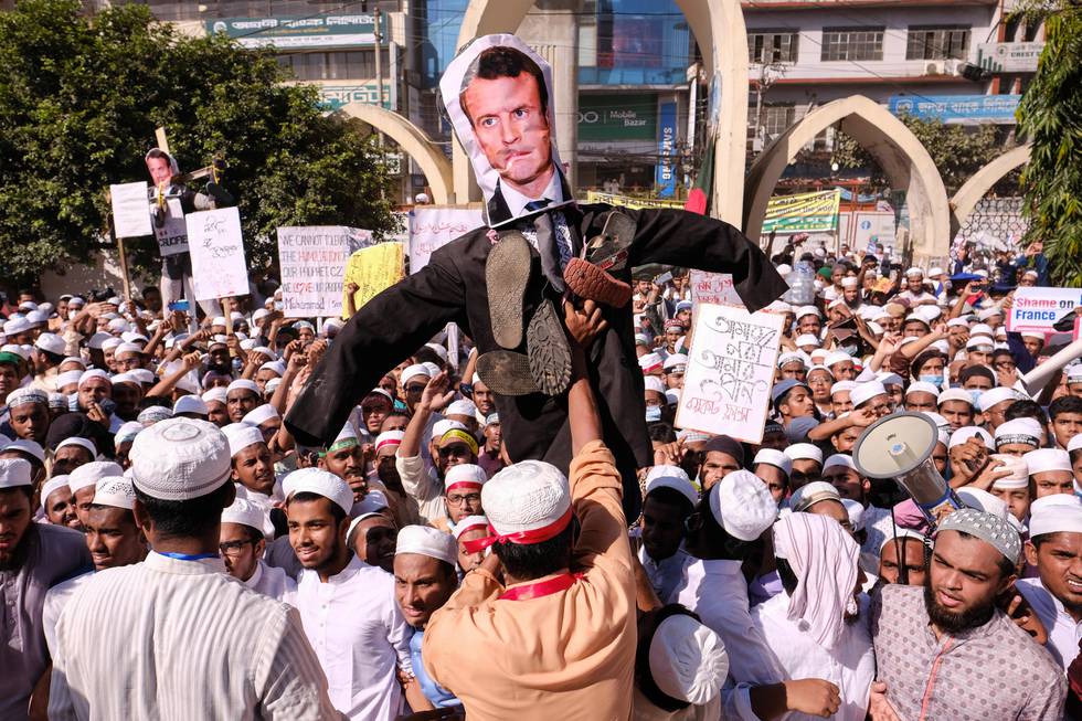 Supporters of Islamist parties carry an effigy of French President Emmanuel Macron during a protest after Friday prayers in Dhaka, Bangladesh, Friday, Oct. 30, 2020. Thousands of Muslims and activists marched through streets and rallied across Bangladeshs capital on Friday against the French presidents support of secular laws that deem caricatures of the Prophet Muhammad as protected under freedom of speech. (AP Photo/Mahmud Hossain Opu)