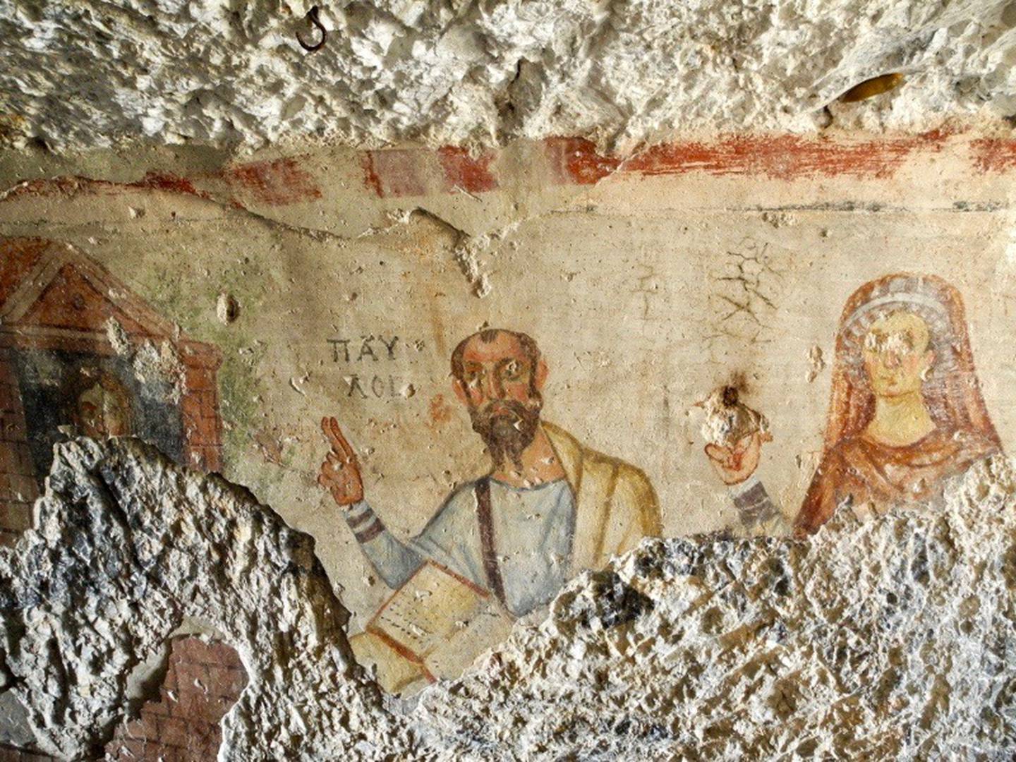 A 5th-6th c. CE fresco in the Ephesus Paul and Thecla grotto: Thekla appears at a window, listening to Paul as he preaches with his raised right hand on an open codex. Theokleia, Thekla’s mother, stands with her right hand raised in admonition.