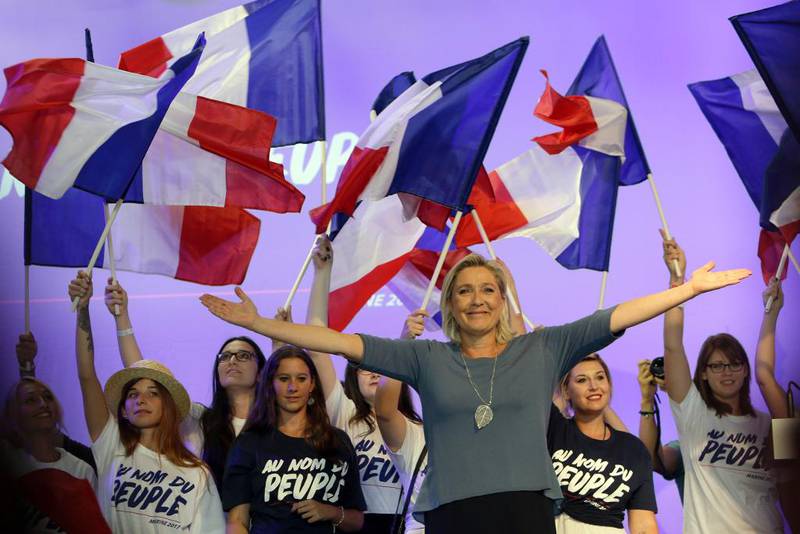 France's far-right National Front president Marine Le Pen, waves to supporters during the summer meeting, 'Les Estivales de Marine Le Pen', in Frejus, southern France, Sunday, Sep. 18, 2016. (AP Photo/Claude Paris)