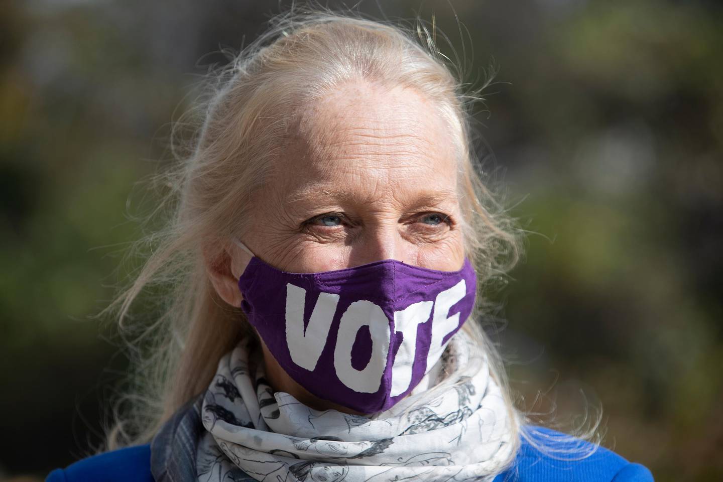 Congresswoman Mary Gay Scanlon wears a vote mask as she stops at at a polling location in Brookhaven, Delaware County, Pa. on Tuesday, Nov. 3, 2020. (Charles Fox/The Philadelphia Inquirer via AP)
