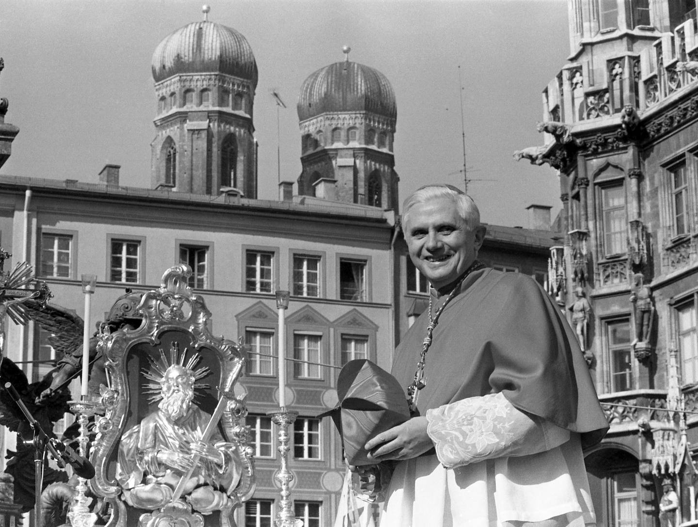 FILE - With the towers of Munich's cathedral in the background, Cardinal Joseph Ratzinger, later Pope Benedict XVI who retired in 2013, bids farewell to the Bavarian believers in downtown Munich, Germany, Sunday, Feb. 28, 1982. A report on decades of sexual abuse that shone an unflattering spotlight on retired Pope Benedict XVI has come on top of already strong pressure in Germany to reconsider Catholic rules on issues including homosexuality and women’s roles, adding to a mounting sense of impatience in the country's church. (AP Photo/Dieter Endlicher, File)