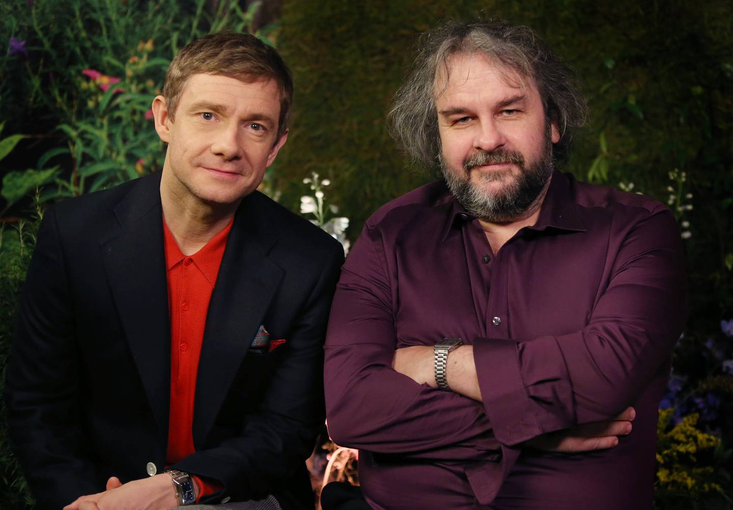 In this picture taken on Monday, Dec. 1, 2014 British actor Martin Freeman and director Peter Jackson from New Zealand poses for photographs in promotion for the film 'The Hobbit, Battle of the Five Armies' in the Claridges suite in west London. After a long and eventful journey, "The Hobbit" trilogy has reached its bloody climax. Not a minute too soon for director Peter Jackson, who has been longing to unleash mayhem on Middle Earth. "It's the first time we've got to kill dwarves," said the director, his enthusiasm for death and destruction at odds with his laid-back manner and luxurious surroundings in a London hotel suite. "It's hard to get any emotional power in a film unless you are able to actually kill some of your main characters,? he said. ?We've been hampered with that in the first two 'Hobbit' movies. But at least we have a good dwarf death toll in the third one." "The Hobbit: The Battle of the Five Armies" wraps up the trilogy spun from J.R.R. Tolkien's slim book about home-loving hobbit Bilbo Baggins, coaxed away from his burrow to help a band of dwarves retake their mountain home from a destructive dragon. (Photo by Joel Ryan/Invision/AP) 
