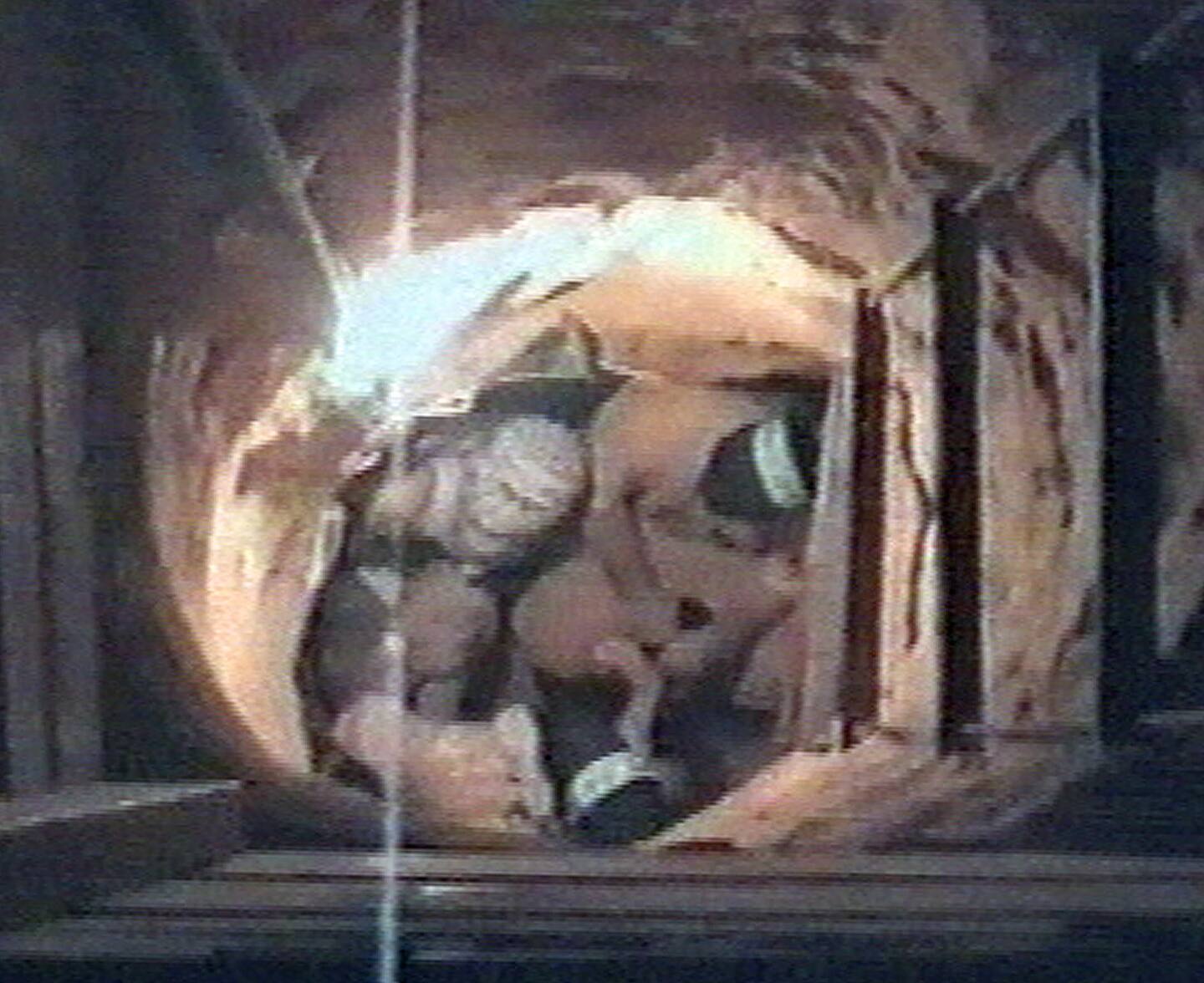 This frame grab taken from a video, purportedly made by the militant Palestinian group Hamas and obtained by the Associated Press Sunday, Dec. 12, 2004, shows masked militants sitting in a tunnel near the Gaza-Egypt crossing. Palestinian militants blew up an Israeli army base at the Gaza-Egypt crossing Sunday by sneaking more than a ton of explosives through a tunnel, killing four Israeli soldiers and wounding at least 10 _ the largest Palestinian attack in the month since Yasser Arafat's death. (AP Photo) ** TV OUT **