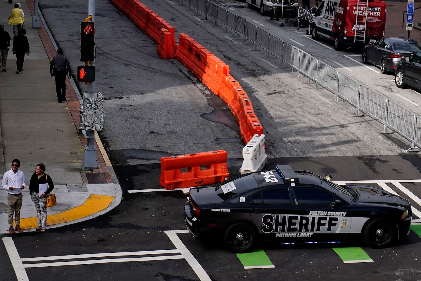 Barricades are seen near the Fulton County courthouse, Monday, Aug. 7, 2023, in Atlanta. The sheriff's office are implementing various security measures ahead of District Attorney Fani Willis possibly seeking an indictment in her investigation into whether former President Donald Trump and his allies illegally meddled in the 2020 election in Georgia. (AP Photo/Brynn Anderson)