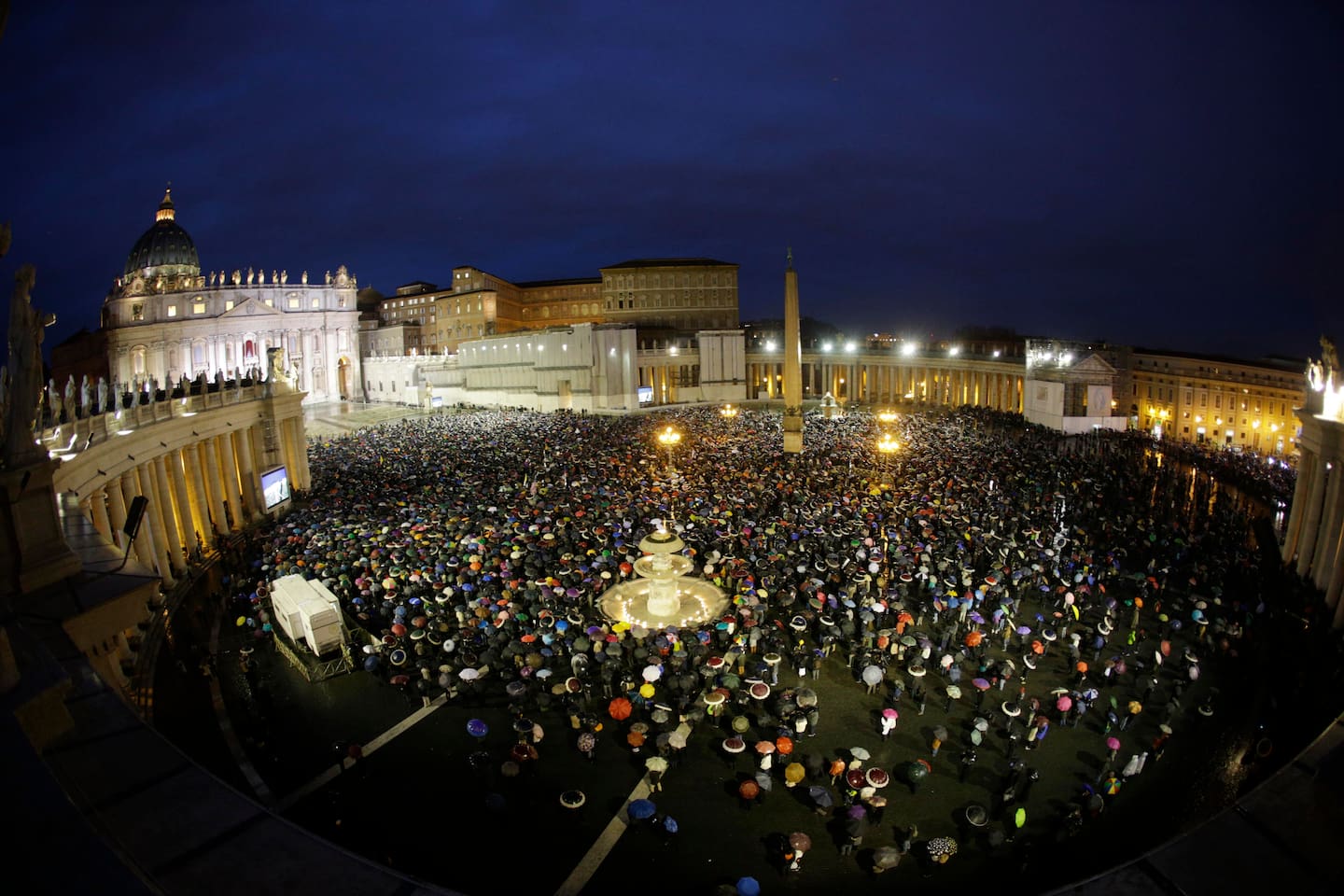 Crowds gather in St. Peter's Square to wait for the election of a new pope by the cardinals in conclave in the Sistine Chapel at the Vatican, Wednesday, March 13, 2013. (AP Photo/Andrew Medichini)