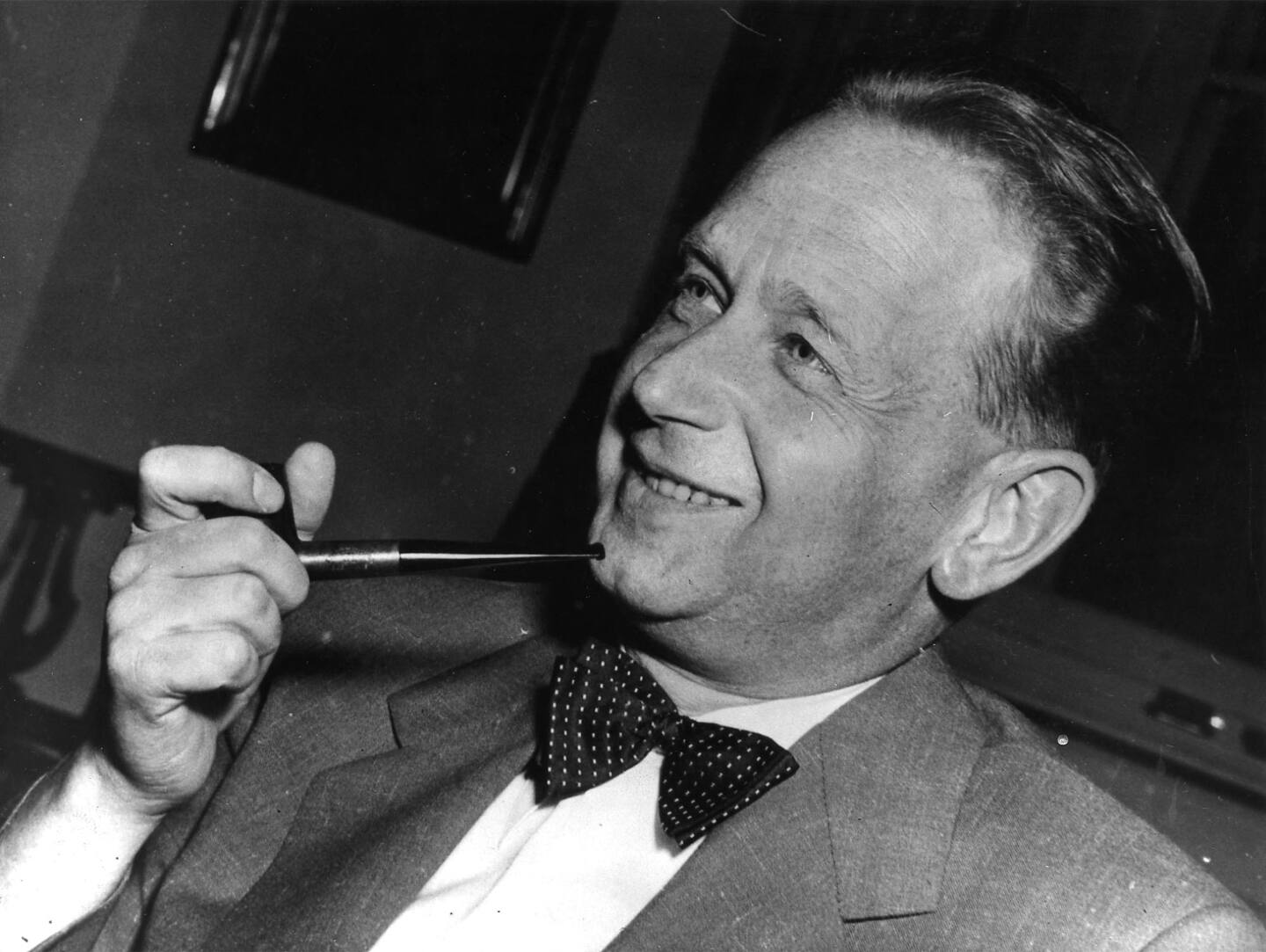 FILE - In this May 19, 1953 file photo, Dag Hammarskjold, recently appointed secretary general of the United Nations who is on a visit to Sweden, smokes his pipe at a press conference held at the Foreign Office in Stockholm. Americas National Security Agency may hold crucial evidence about one of the greatest unsolved mysteries of the Cold War _ the cause of the 1961 plane crash which killed United Nations Secretary-General Dag Hammarskjold, a commission which reviewed the case said Monday, Sept. 9, 2013. Widely considered the U.N.s most effective chief, Hammarskjold died as he was attempting to bring peace to the newly independent Congo. The crash of his DC-6 aircraft in the forest near Ndola Airport in modern-day Zambia has bred a rash of conspiracy theories, many centering on some startling inconsistencies. (AP Photo)