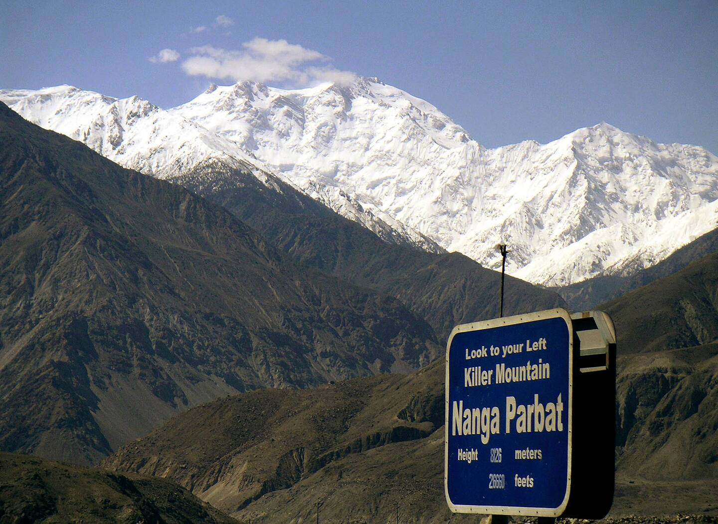 FILE - In this May 4, 2004 file photo, Nanga Parbat, the ninth highest mountain in the world, is seen from Karakorum Highway leading to neighboring China in Pakistan's northern area. Gunmen wearing police uniforms killed 11 foreign tourists and one Pakistani before dawn Sunday, June 23, 2013 as they were visiting one of the worlds highest mountains in a remote area of northern Pakistan, officials said. (AP Photo/Musaf Zaman Kazmi, File)