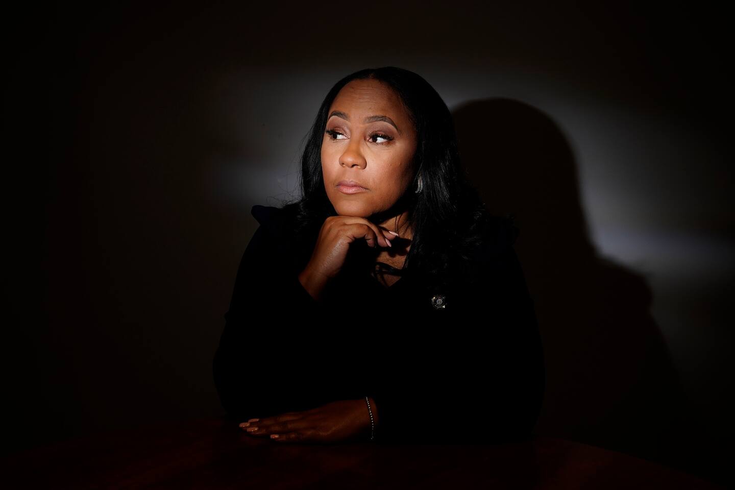 FILE - Fulton County District Attorney Fani Willis poses for a portrait, Wednesday, April 19, 2023, in Atlanta. Willis is expected to seek a grand jury indictment in the coming weeks in her investigation into efforts by Donald Trump and his allies to overturn the former president's 2020 election loss. Willis began investigating more than two years ago, shortly after a recording was released of a January 2021 phone call Trump made to Georgia's secretary of state. (AP Photo/Brynn Anderson, File)