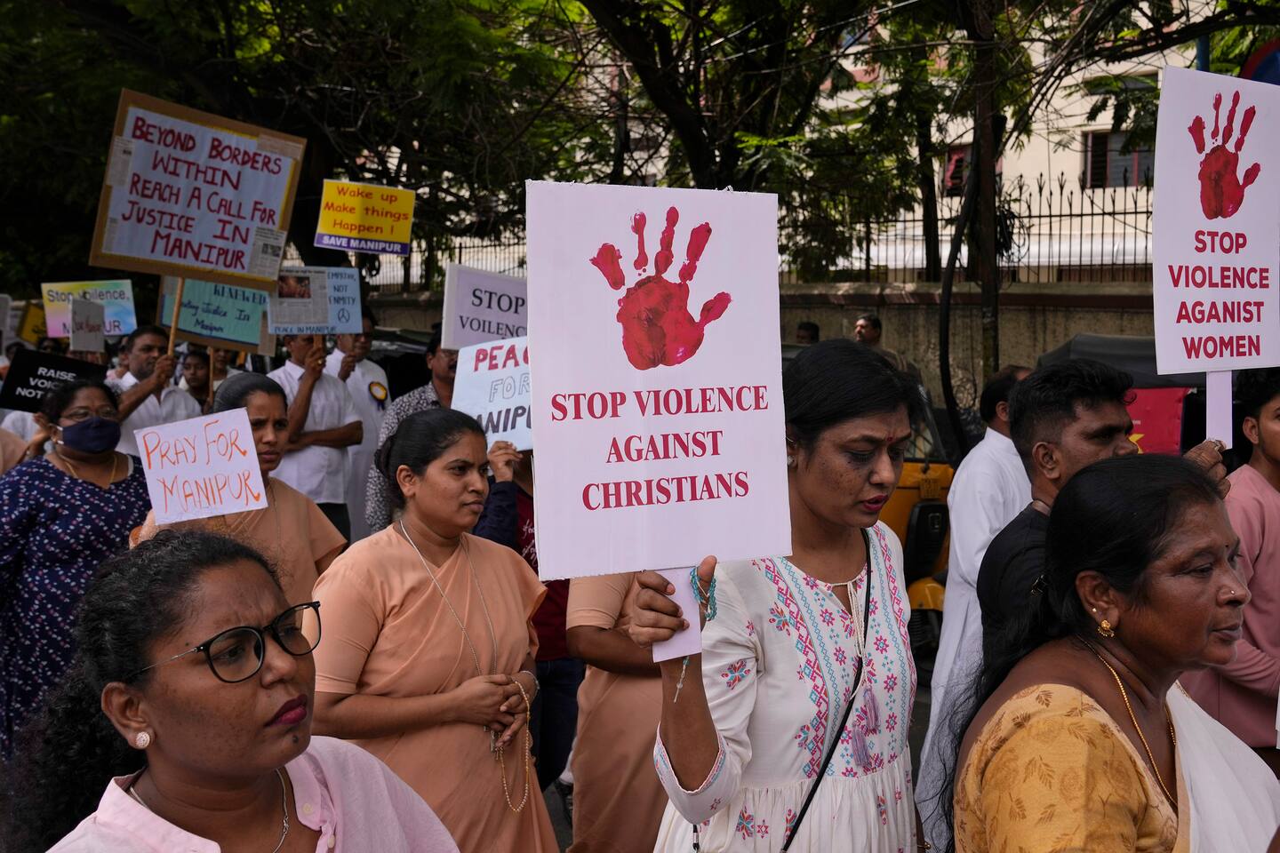 Catholic Christians hold placards and participate in a peace rally against violence in the northeastern Manipur state, in Hyderabad, India, Friday, Aug. 25, 2023. The conflict was triggered by an affirmative action controversy in which Christian Kukis protested a demand by mostly Meitei Hindus for a special status that would let them buy land in the hills populated by Kukis and other tribal groups, and get a share of government jobs. More than 150 people have lost their lives, 68 of them in the first three days of violence that started in May. (AP Photo/Mahesh Kumar A.)
