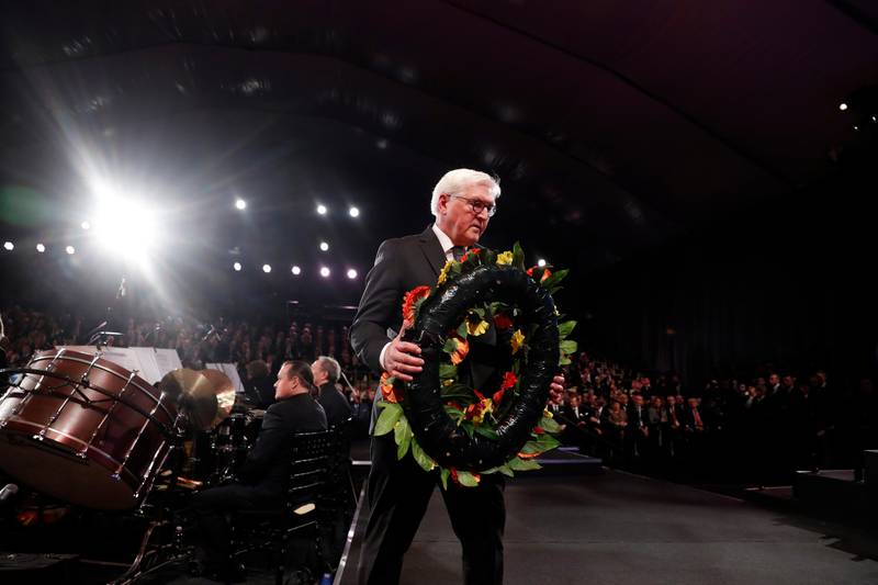 German President Frank-Walter Steinmeier takes part in a wreath-laying ceremony at the World Holocaust Forum marking 75 years since the liberation of the Nazi extermination camp Auschwitz, at Yad Vashem Holocaust memorial centre in Jerusalem, Thursday, Jan. 23, 2020. (Ronen Zvulun, Pool via AP)