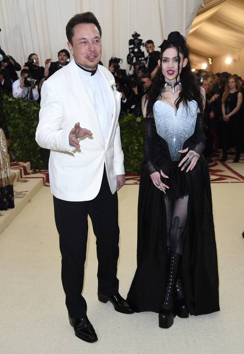 Elon Musk, left and Grimes attend The Metropolitan Museum of Art's Costume Institute benefit gala celebrating the opening of the Heavenly Bodies: Fashion and the Catholic Imagination exhibition on Monday, May 7, 2018, in New York. (Photo by Evan Agostini/Invision/AP)