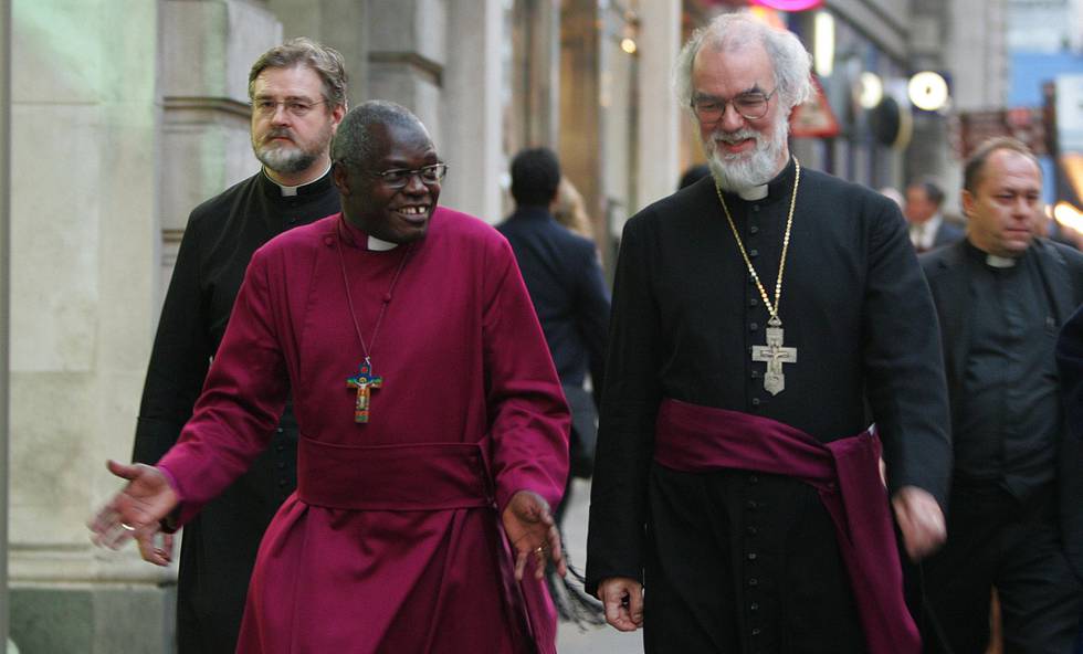 Dr John Sentamu as Archbishop of York, elect, front left, on his way to a reception with the Archbishop of Canterbury Dr Rowan Williams, at right, following a service in London to confirm Sentamu's election to the See of York, Wednesday Oct. 5, 2005.   Ugandan-born Sentamu becomes The Archbishop of York, the second highest postition within the Chrurch of England, when he is enthroned on Nov. 5. (AP Photo/Alastair Grant)