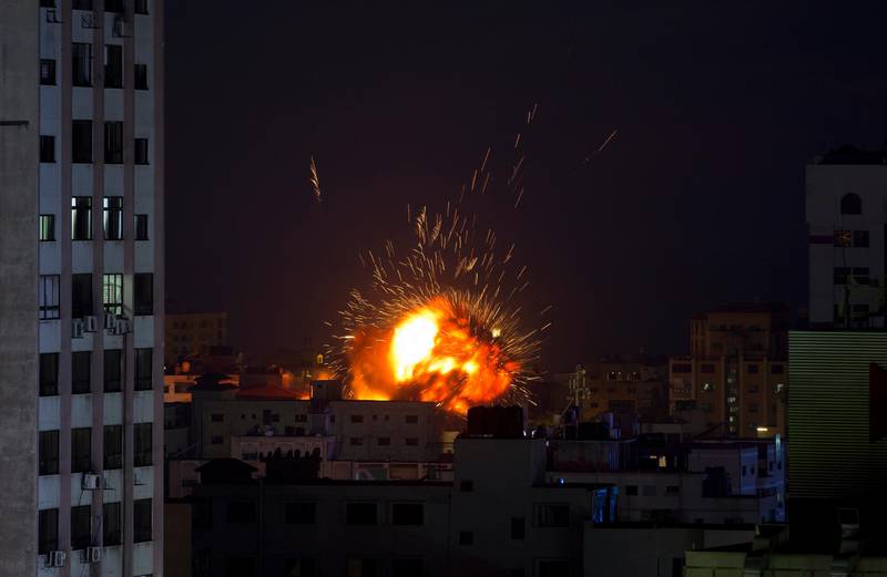An explosion caused by an Israeli airstrike on a building in Gaza City, Saturday, May 4, 2019. Palestinian militants in the Gaza Strip fired at least 90 rockets into southern Israel on Saturday, according to the Israeli military, triggering retaliatory airstrikes and tank fire against militant targets in the blockaded enclave and shattering a month-long lull in violence. (AP Photo/Khalil Hamra)