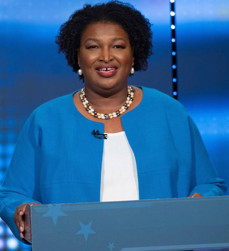 Republican Georgia Gov. Brian Kemp and Democratic challenger Stacey Abrams face off in a televised debate, in Atlanta, Sunday, Oct. 30, 2022. (AP Photo/Ben Gray)